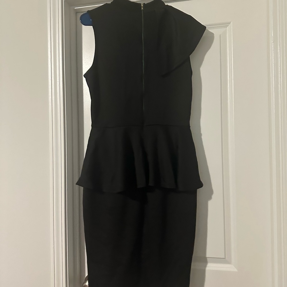 Black peplum sleeveless dress.